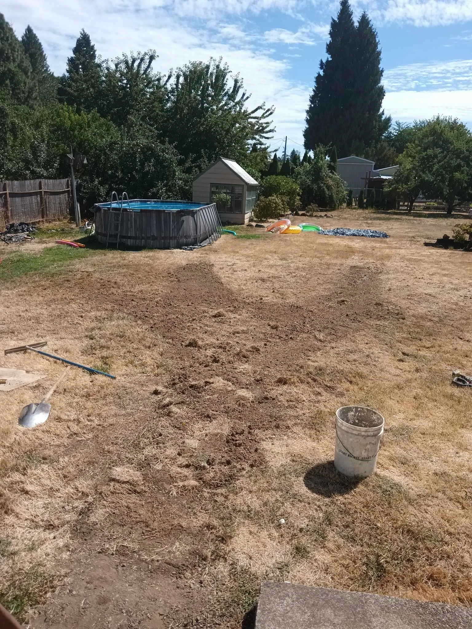The backyard filled and graded after the pipe work