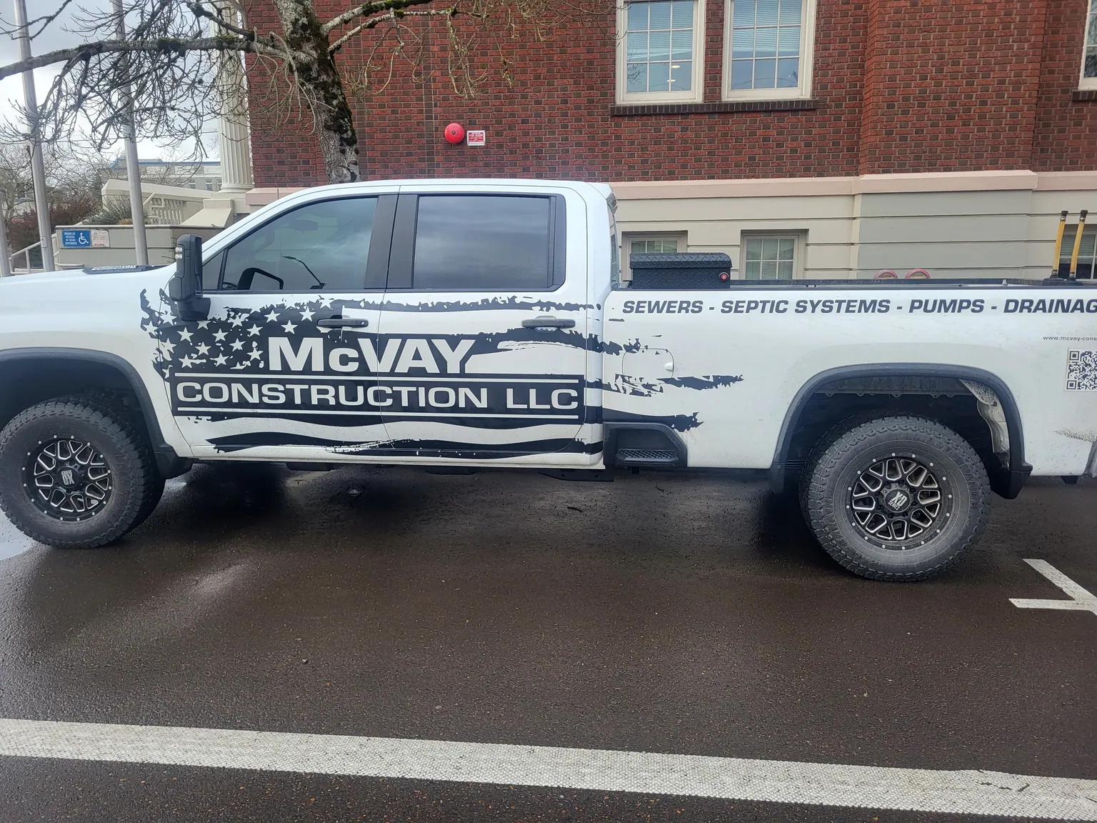 McVay Construction LLC work truck with the company name on the door
